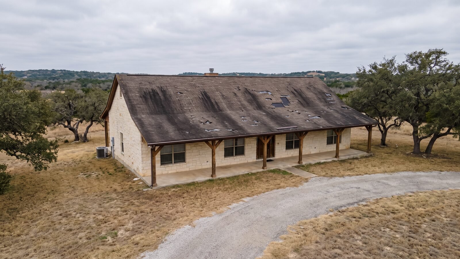 Aging asphalt shingle roof before replacement